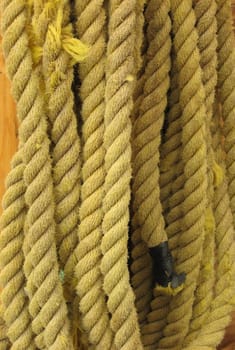 Yellow rope, hanging on a wall