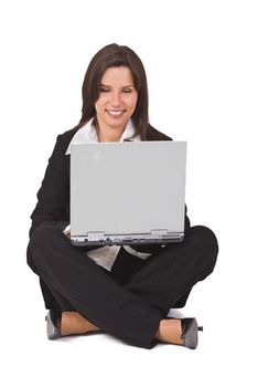 Businesswoman sitting with a laptop in her lap