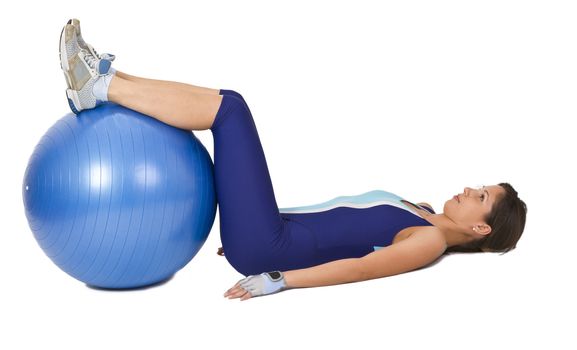 Woman lying down with a gym ball- interesting and unusual perspective.