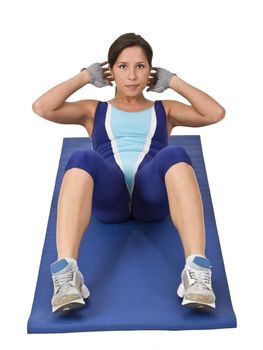 Image of a woman doing aerobics on a blue mat.Shot with Canon 70-200mm f/2.8L IS USM