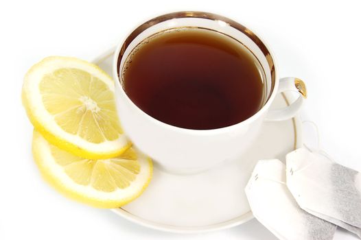 cup of tea , teabugs, lemon isolated on white