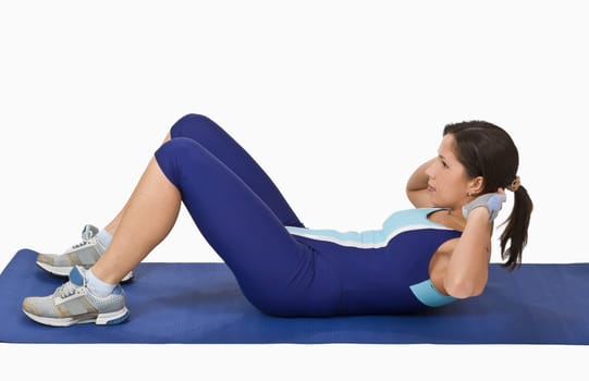 Image of a woman doing aerobics on a blue mat.