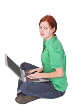 Redheaded girl sitting with a laptop in her lap.Shot with Canon 70-200mm f/2.8L IS USM