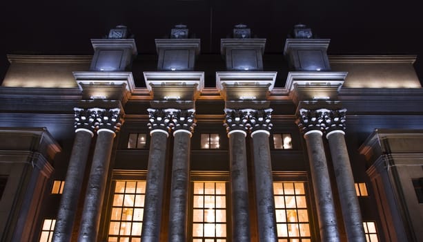 Stalin's classical architecture. Columns with capitals. Night view.