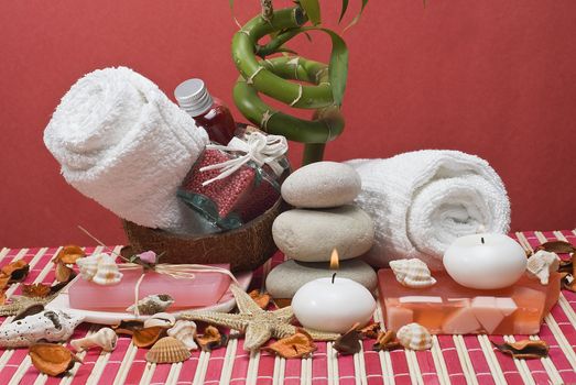 Still life about spa with some hygiene items in red.