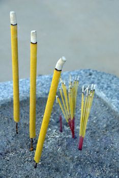 an isolated shot of Incense Sticks Burning in Chinese Temple