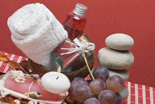 Still life about spa with some hygiene items in red.