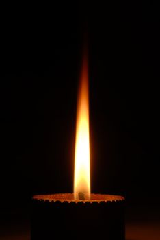 an isolated shot of a Candle Burning at night