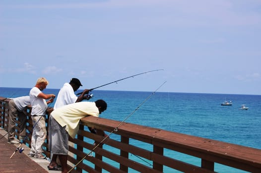 Men fishing on pier