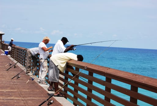 Men fishing on pier