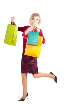 Beautiful woman with shopping bags isolated on white