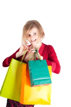 Beautiful woman with shopping bags isolated on white