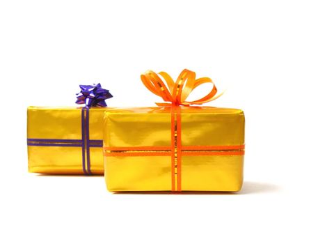  present boxes in gold wrap and orange belt with bow