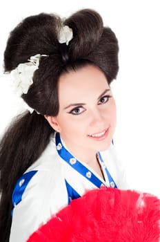 Portrait of the girl of the Asian appearance with a make-up under the geisha on a white background