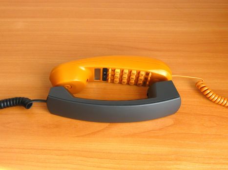 yellow and black telephone tubes on the color background 