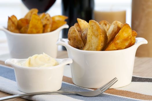 Spanish tapas, patatas bravas with garlic mayonnaise dipping sauce.