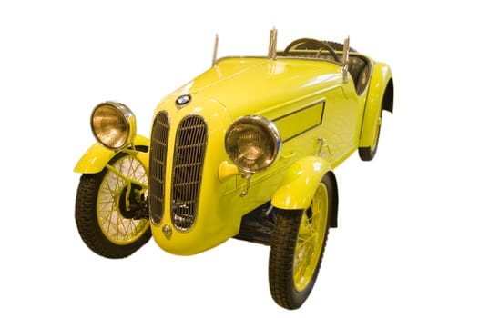 The ancient yellow car isolated on the white