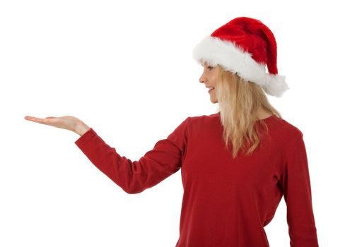 Christmas girl wearing Santa hat, holding hand palm up, ready to hold a present.
