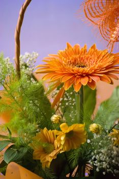 orange gerbera bouquet in basket 