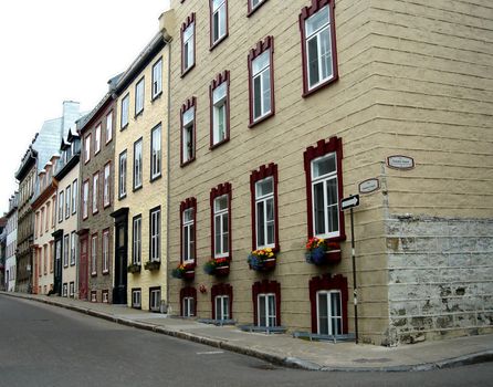 Street in old Quebec, Canada, with the typical facade and windows of a house