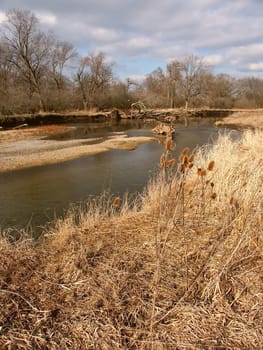 The Kishwaukee River winds through northern Illinois on a sunny autumn day.
