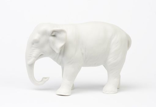 White elephant figure over white background.