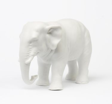 White elephant figure over white background.