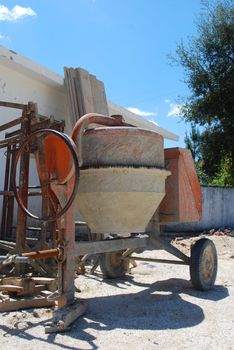 orange cement mixer at a construction site