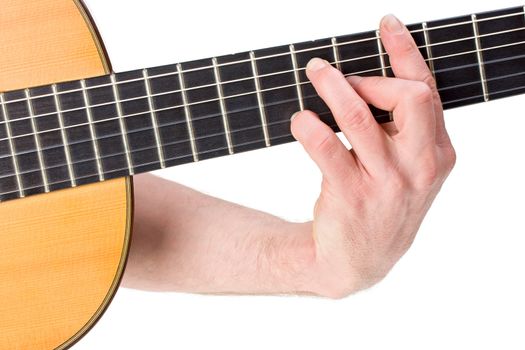 male hand holding a chord on a classsical guitar