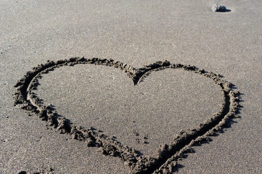 Heart drawing in the sand