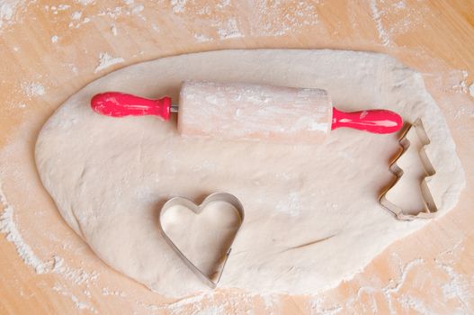 Rolling pin for children with dough and two shapes