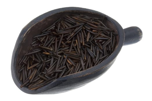 black wild rice on a rustic wooden scoop isolated on white background