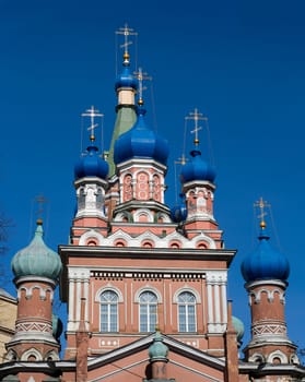 Red Orthodox church against deep blue sky