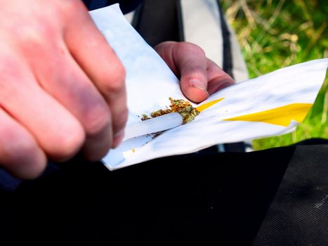 Drugs - Filling a marijuana joint