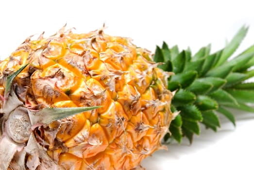 ripe vivid pineapple close up over white background