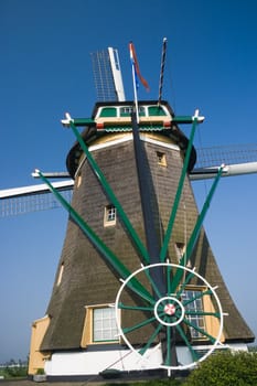 Dutch watermill backside with wheel  to turn the wings in the wind