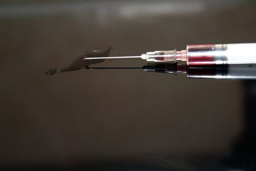 Needle & Syringe isolated on black