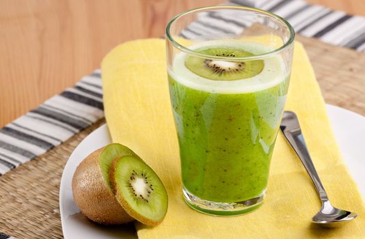 A tasty kiwi smoothie in a natural setting