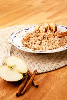 Apple Cinnamon Porridge - shallow depth of field with focus on the bowl
