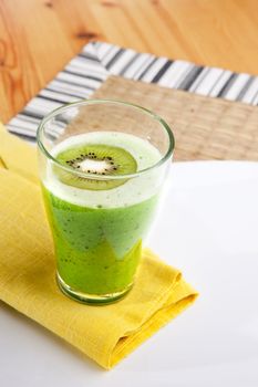A tasty kiwi smoothie in a natural setting