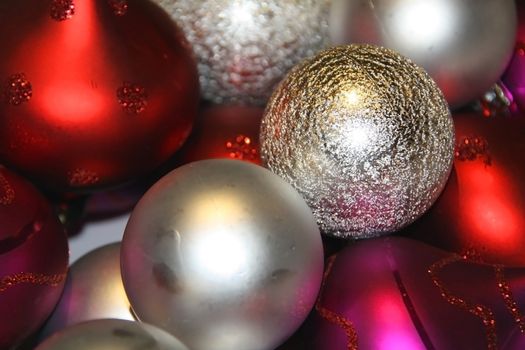 Shiny balls in red, purple and silver