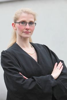 firm lawyer with arms folded and Robe
