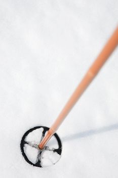 A ski pole in snow