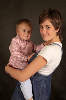 Picture of happy mother with baby in studio