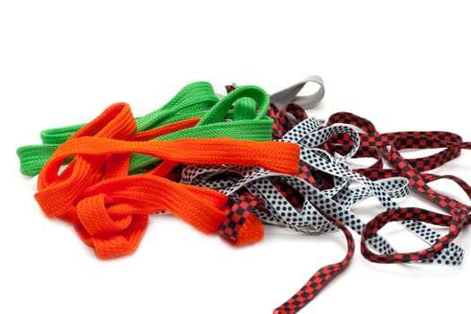 Colour shoelace, purple, green, varicoloured insulated on white background