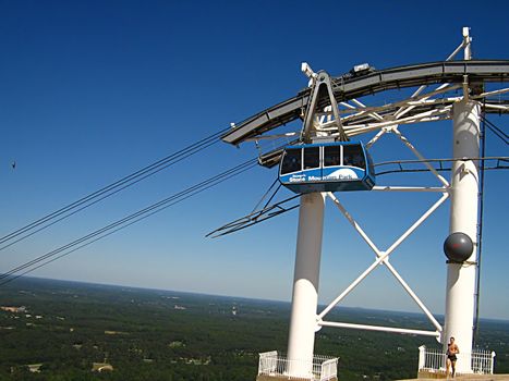 A photograph of a cable car in action.