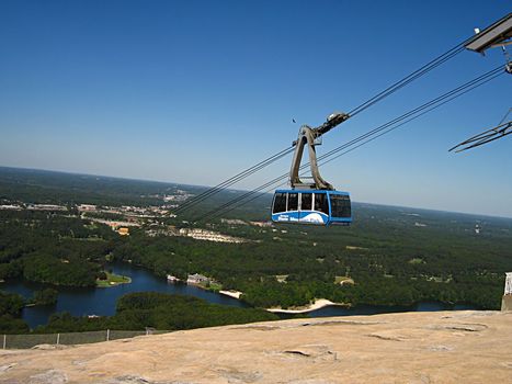 A photograph of a cable car in action.