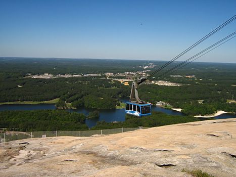 A photograph of a cable car in action.