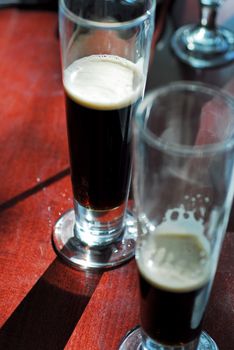 Dark brown beer served in Flute glasses St Patrick Day