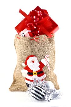 Bag full of christmas presents, isolated on white.